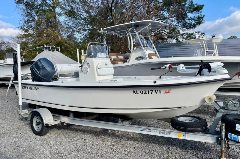 The Image of 2013 Key West 172 SE boat on trailer with Yamaha motor, parked outdoors. - 0