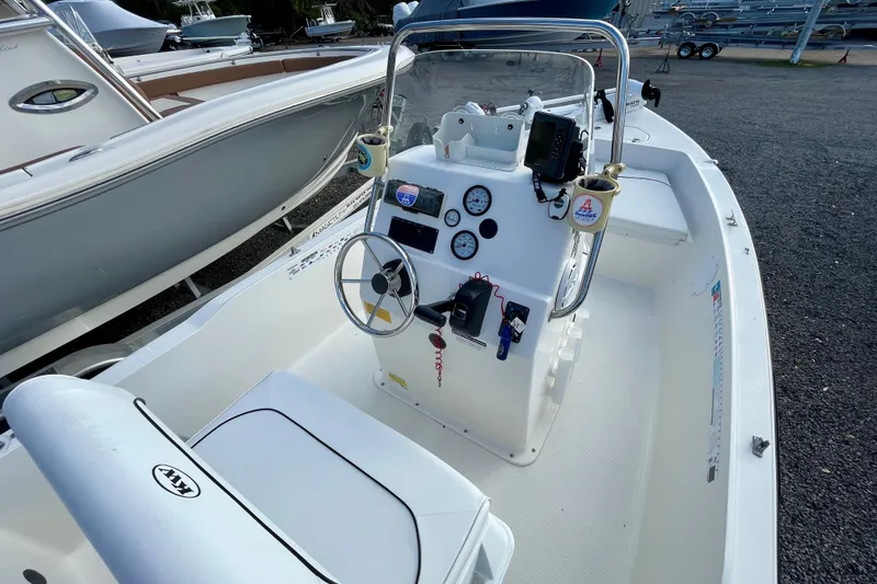 Slide: The Image of 2013 Key West 172 SE boat interior with steering console and gauges. - 13