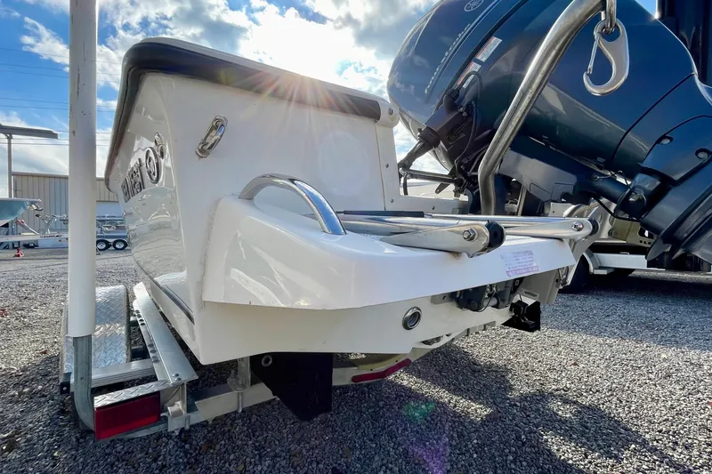 Slide: The Image of 2013 Key West 172 SE boat on trailer, with outboard motor, under sunny sky. - 9
