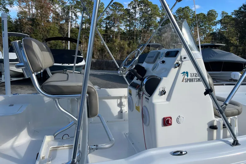Slide: The Image of 2022 Key West 1720 Sportsman boat interior with seating and control panel. - 11