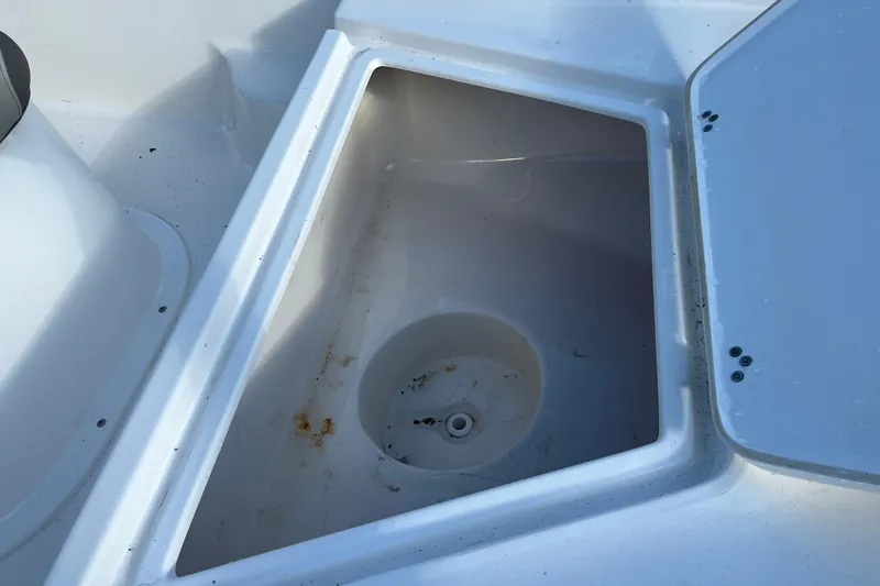 Slide: The Image of Open storage compartment on a 2022 Key West 1720 Sportsman boat. - 16