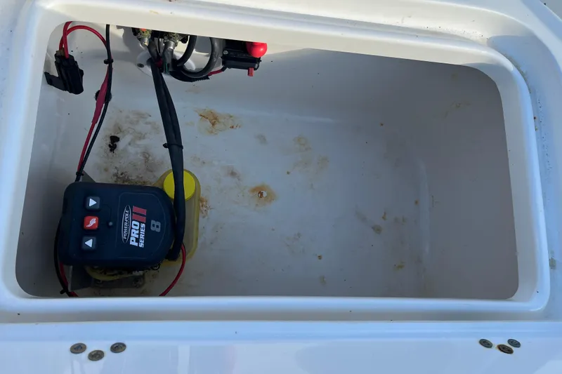 Slide: The Image of Battery compartment of 2022 Key West 1720 Sportsman boat with wiring and charger. - 22