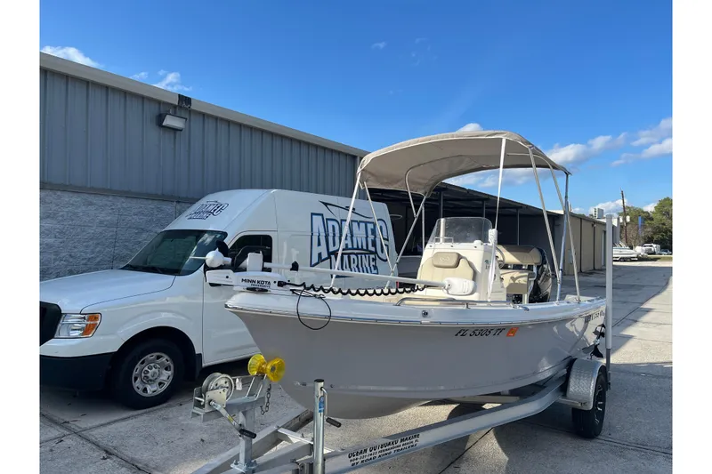 Slide: The Image of 2022 Key West 1720 Sportsman boat on trailer outside marine shop. - 3