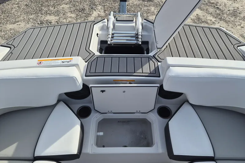 Slide: The Image of 2026 Starcraft SVX 191 OB boat interior with seating and storage compartments. - 12
