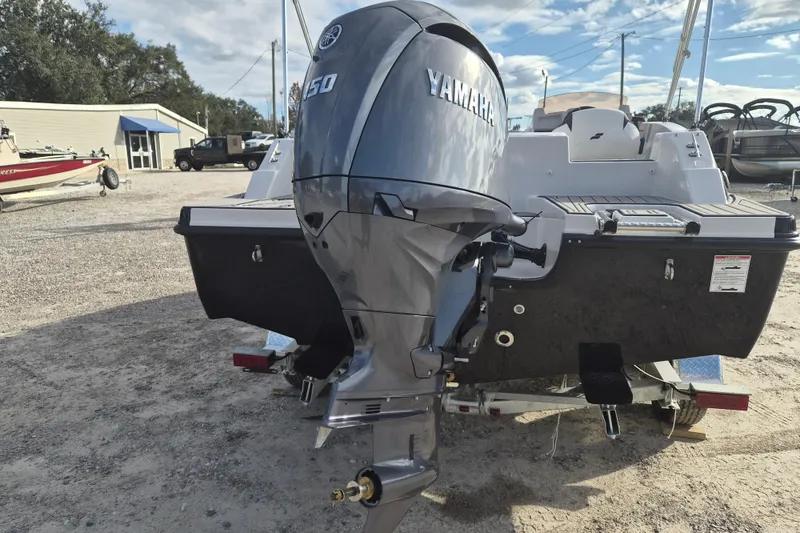 Slide: The Image of 2026 Starcraft SVX 191 OB boat with Yamaha 150 outboard motor, parked outdoors. - 15