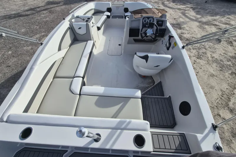 Slide: The Image of 2026 Starcraft SVX 191 OB boat interior with spacious seating and modern dashboard. - 4