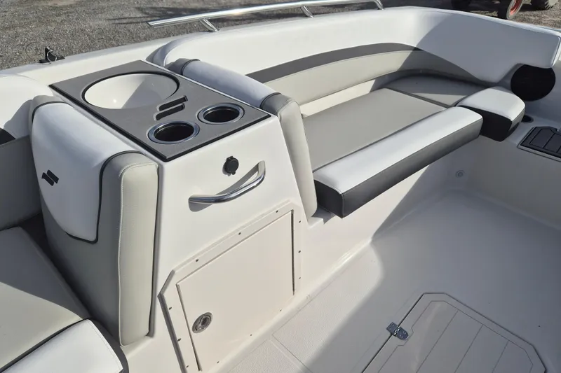 Slide: The Image of 2026 Starcraft SVX 191 OB boat interior with seating and cup holders. - 9