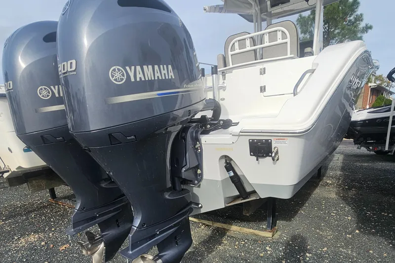 Slide: The Image of 2021 Sea Pro 259 Center Console with twin Yamaha outboard engines. - 18