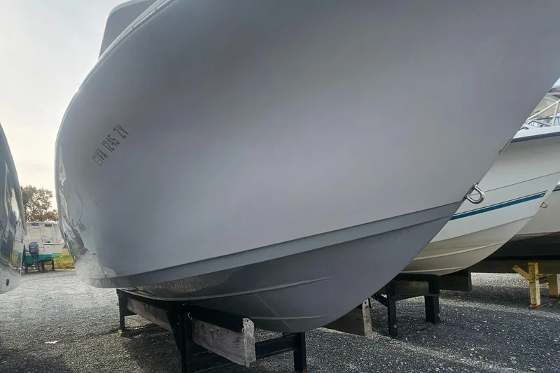 Slide: The Image of 2021 Sea Pro 259 Center Console boat on display, side view. - 19