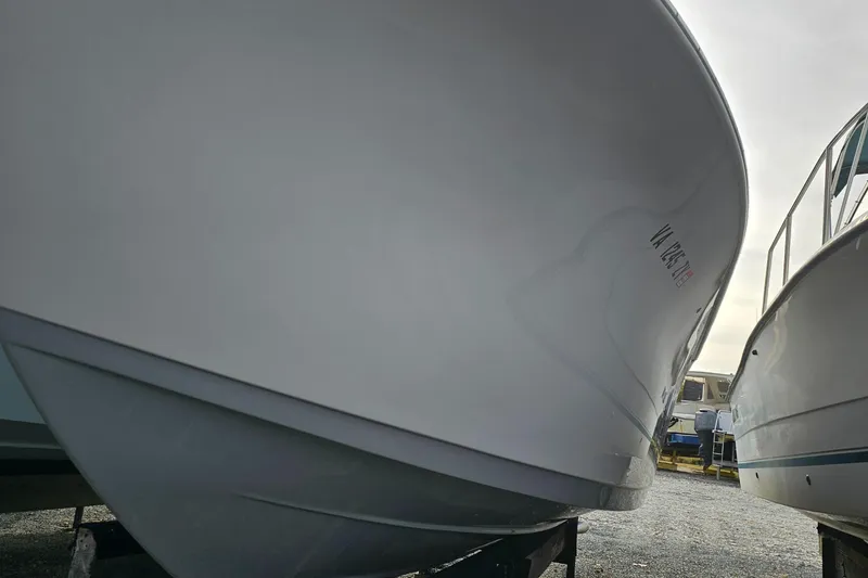 Slide: The Image of 2021 Sea Pro 259 Center Console boat hull in storage. - 20
