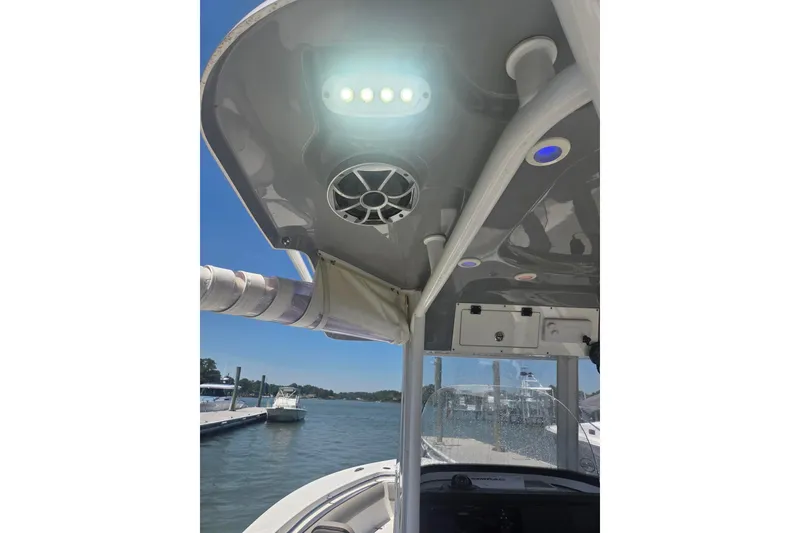 Slide: The Image of 2021 Sea Pro 259 Center Console boat interior with speaker and LED lights. - 21