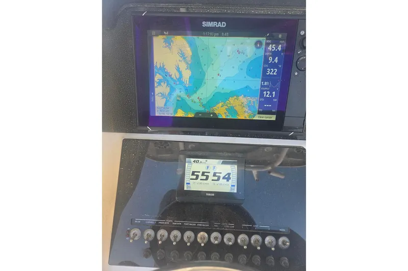 Slide: The Image of Simrad navigation display on 2021 Sea Pro 259 Center Console boat dashboard. - 22