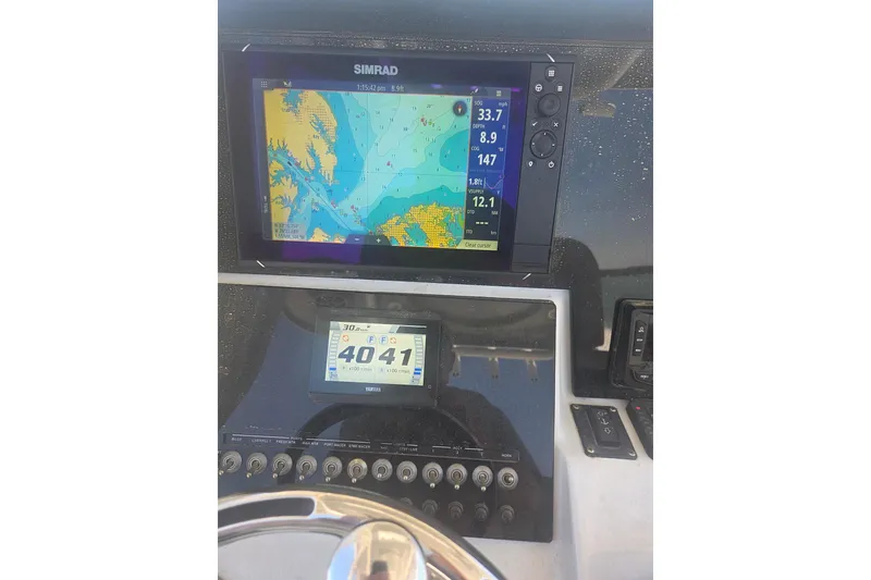 Slide: The Image of Dashboard of 2021 Sea Pro 259 Center Console with navigation display. - 23