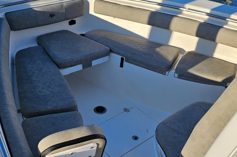 Slide: The Image of 2021 Sea Pro 259 Center Console boat interior with cushioned seating. - 3