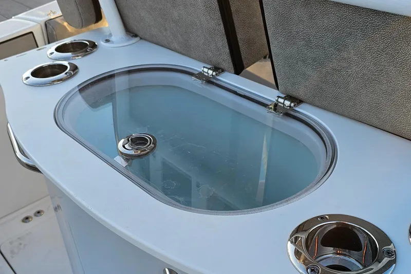 Slide: The Image of Livewell on 2021 Sea Pro 259 Center Console boat with rod holders. - 4