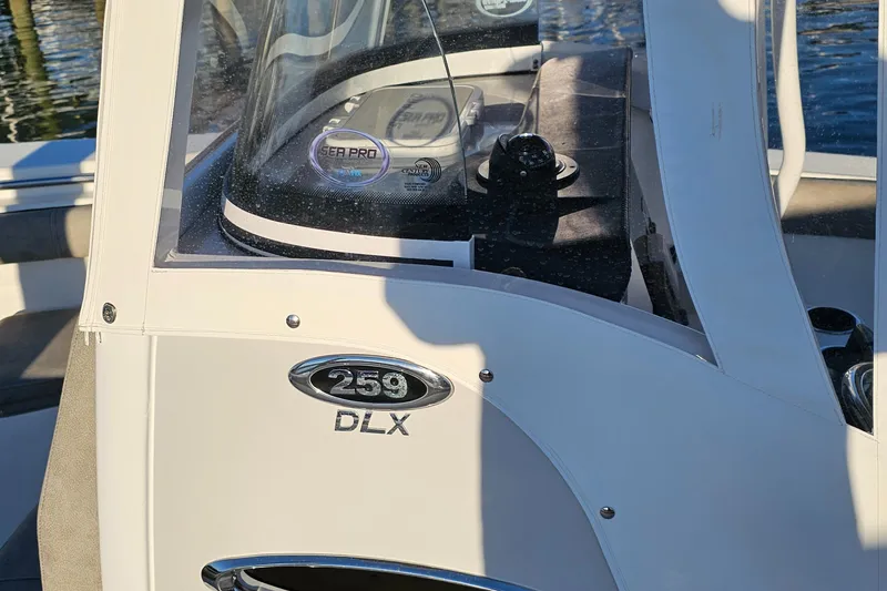 Slide: The Image of 2021 Sea Pro 259 Center Console boat, close-up of console and branding. - 6