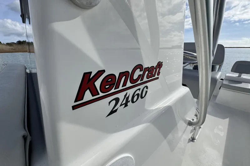 Slide: The Image of 2024 Bay Rider 2460 Skiff boat with KenCraft branding on the side. - 19