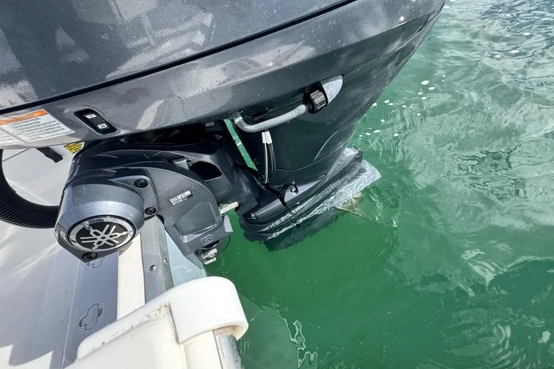 Slide: The Image of Bay Rider 2460 Skiff 2024 outboard motor in water, showcasing engine details. - 27