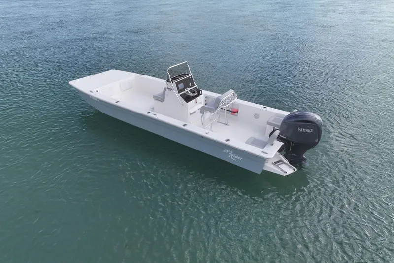 Slide: The Image of 2024 Bay Rider 2460 Skiff on water, featuring Yamaha outboard motor. - 3