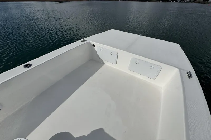 Slide: The Image of 2024 Bay Rider 2460 Skiff boat deck on calm water. - 9