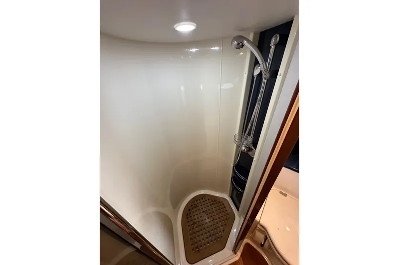 Slide: The Image of Shower area in 2000 Sunseeker Predator 60 yacht, featuring modern fixtures and lighting. - 104