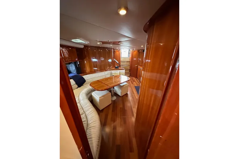 Slide: The Image of Luxurious interior of 2000 Sunseeker Predator 60 yacht with wood finish and seating area. - 108