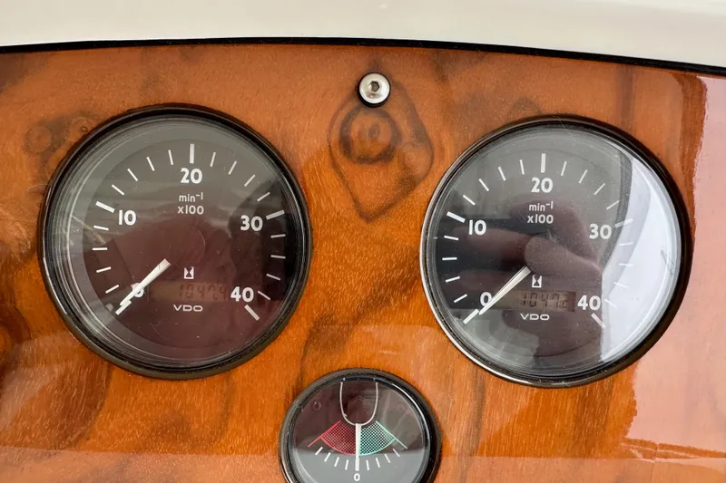 Slide: The Image of Sunseeker Predator 60 2000 dashboard with VDO gauges on wooden panel. - 113