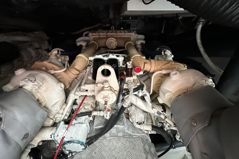 Slide: The Image of Engine compartment of a 2000 Sunseeker Predator 60 yacht, showcasing mechanical components. - 118