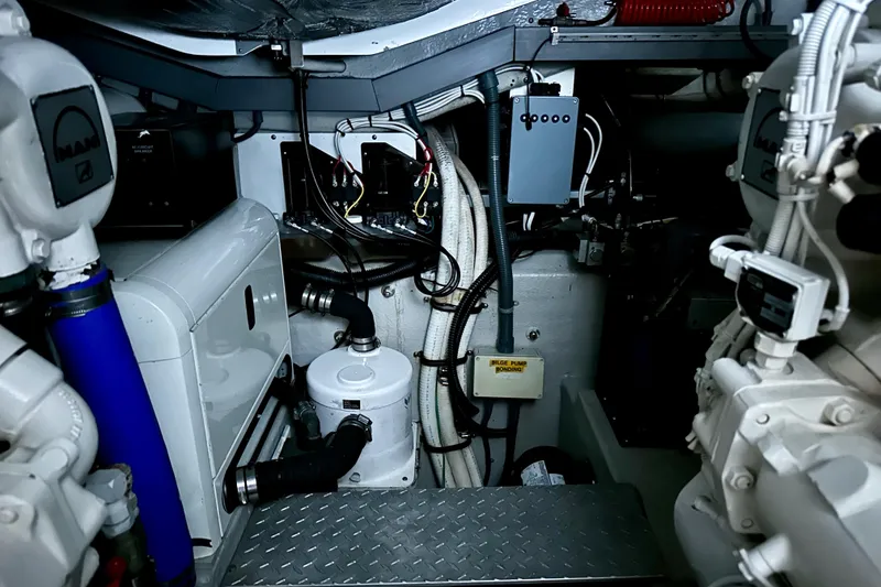 Slide: The Image of Engine room of a 2000 Sunseeker Predator 60 yacht, showcasing mechanical components. - 122