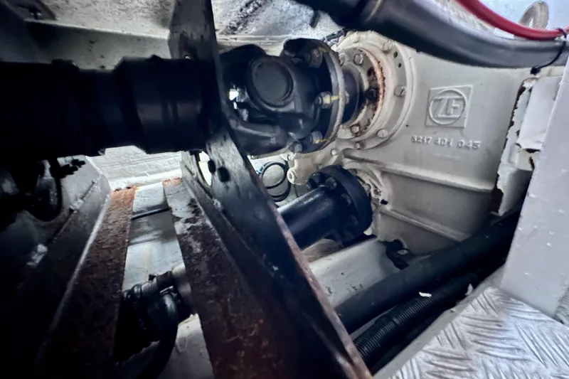 Slide: The Image of Engine compartment of a 2000 Sunseeker Predator 60 yacht, showcasing mechanical components. - 126