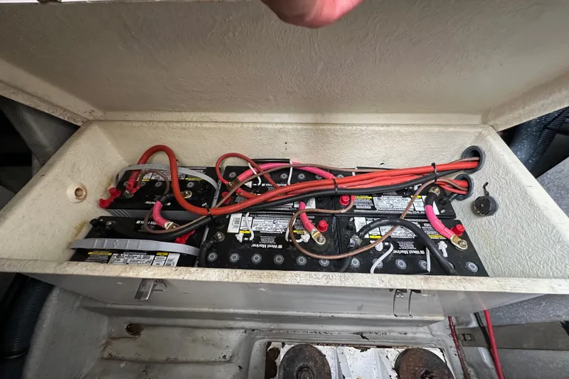 Slide: The Image of Battery compartment of a 2000 Sunseeker Predator 60 yacht with connected cables. - 128