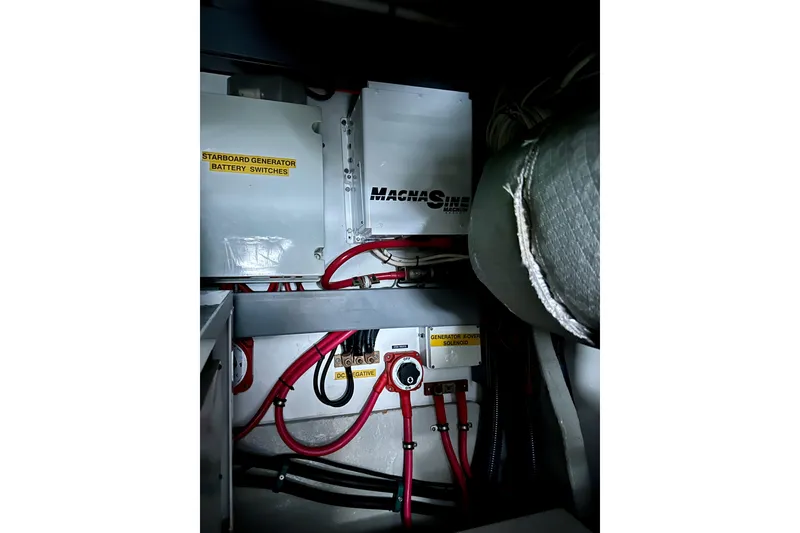 Slide: The Image of Engine room of 2000 Sunseeker Predator 60 with battery switches and wiring. - 130
