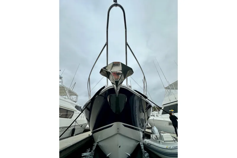Slide: The Image of Front view of a 2000 Sunseeker Predator 60 yacht docked at a marina. - 131