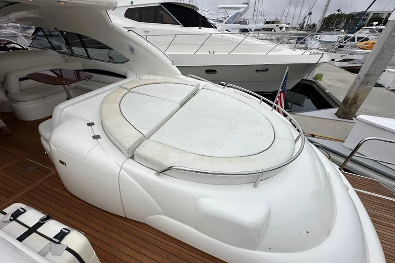Slide: The Image of Luxurious 2000 Sunseeker Predator 60 yacht with spacious deck and elegant seating area. - 15
