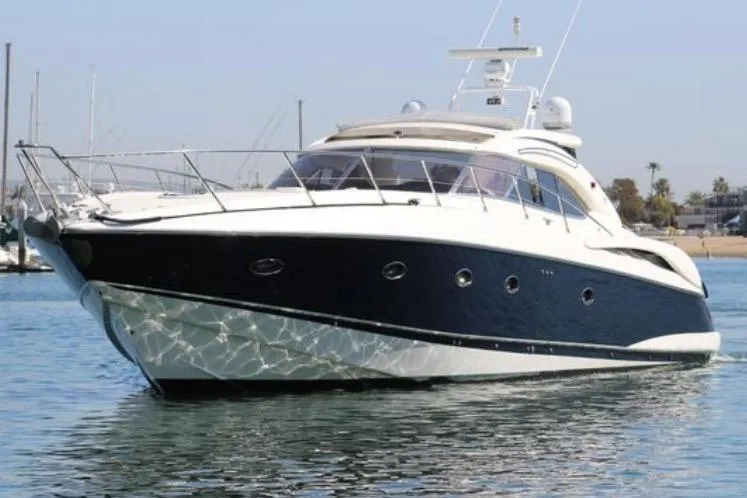 Slide: The Image of 2000 Sunseeker Predator 60 yacht cruising on calm waters. - 2
