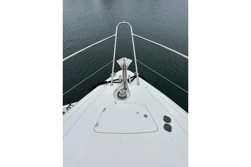 Slide: The Image of Bow view of 2000 Sunseeker Predator 60 yacht on calm water. - 22