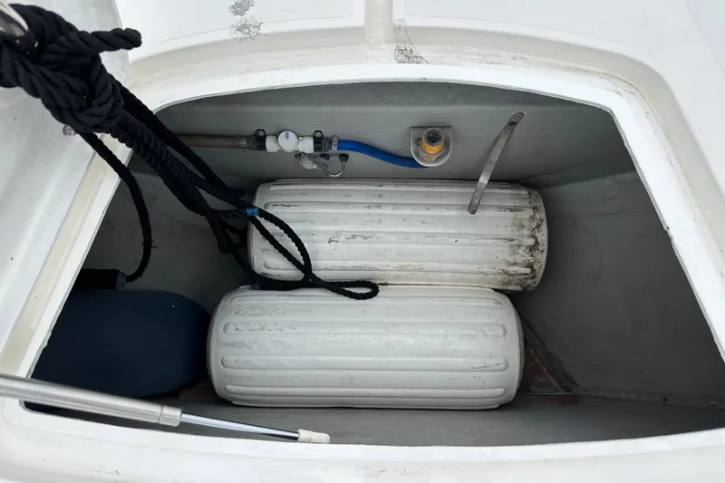 Slide: The Image of Storage compartment of 2000 Sunseeker Predator 60 with fenders and ropes. - 23
