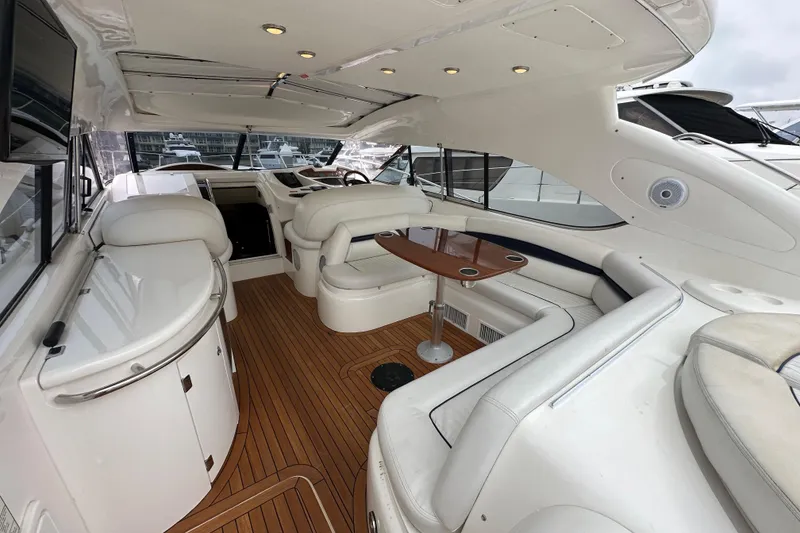 Slide: The Image of Luxurious interior of 2000 Sunseeker Predator 60 yacht with elegant seating and wooden flooring. - 34