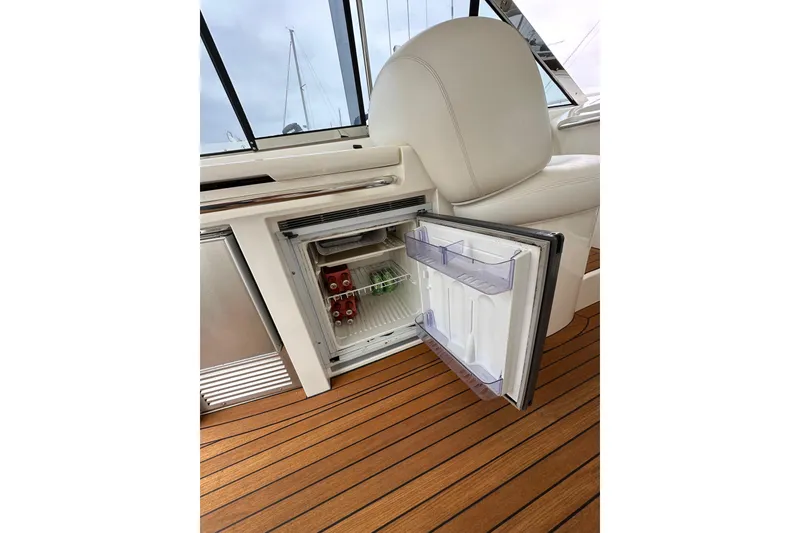 Slide: The Image of Open mini fridge on Sunseeker Predator 60 yacht, showcasing interior with drinks. - 38
