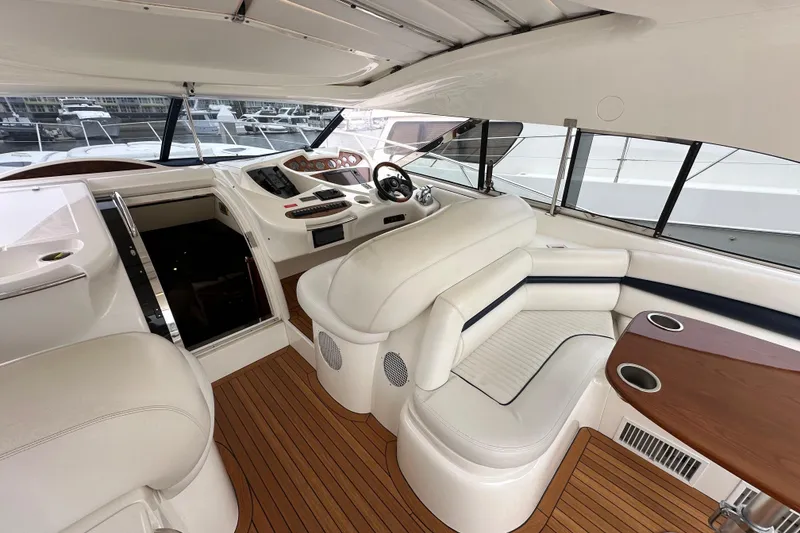 Slide: The Image of Luxurious interior of 2000 Sunseeker Predator 60 yacht with elegant seating and helm. - 40