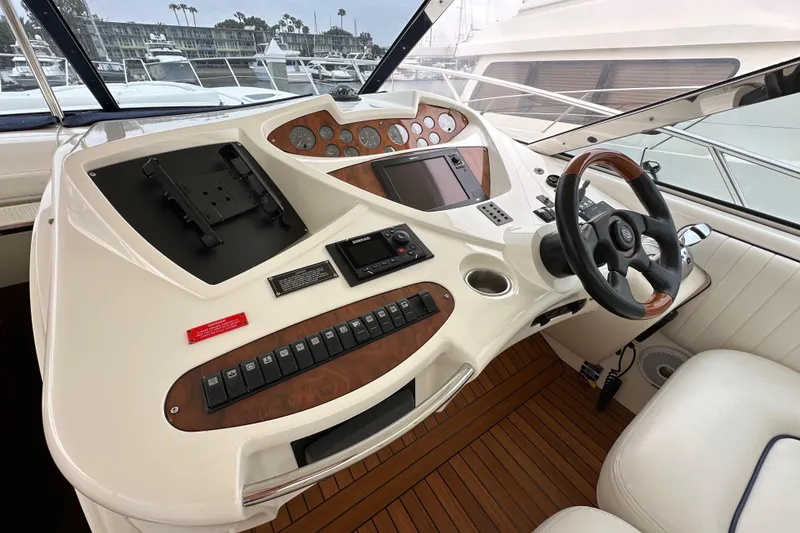 Slide: The Image of Cockpit of 2000 Sunseeker Predator 60 yacht with steering wheel and control panel. - 44