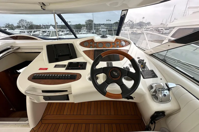 Slide: The Image of Cockpit of 2000 Sunseeker Predator 60 yacht with steering wheel and control panel. - 45