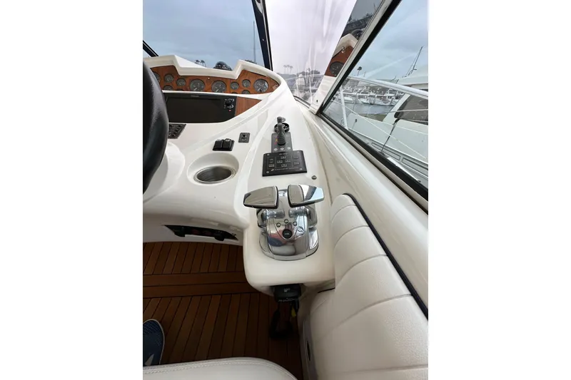 Slide: The Image of Control panel of a 2000 Sunseeker Predator 60 yacht, featuring sleek design and modern instrumentation. - 47