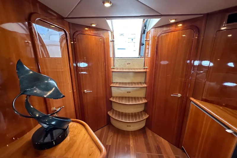 Slide: The Image of Luxurious interior of 2000 Sunseeker Predator 60 yacht with elegant wood finish and modern sculpture. - 55