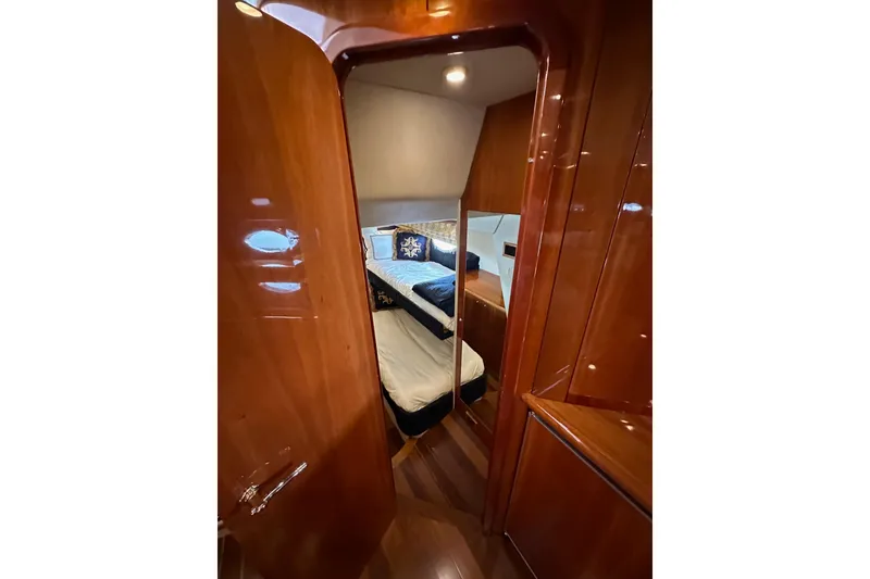 Slide: The Image of Luxurious cabin interior of 2000 Sunseeker Predator 60 yacht with polished wood finish. - 56