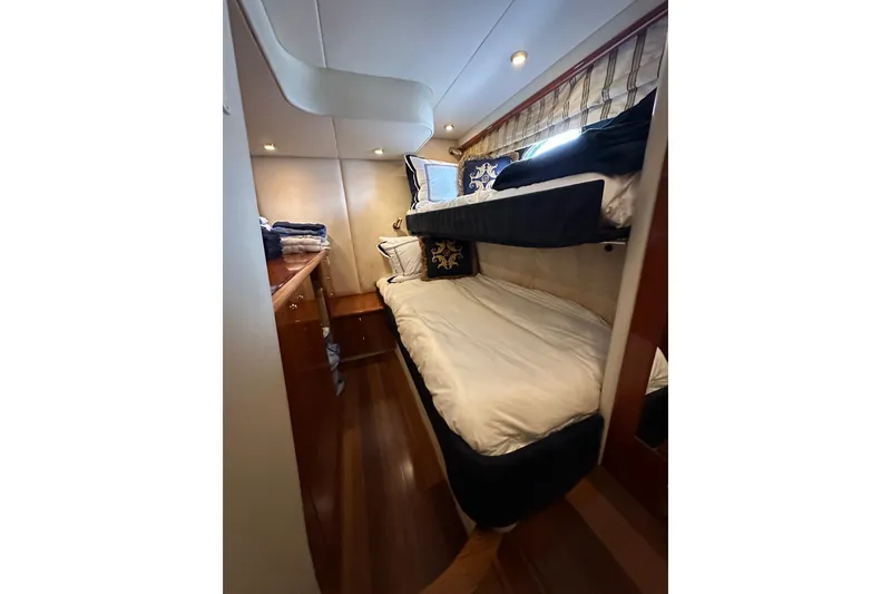 Slide: The Image of Sunseeker Predator 60 yacht cabin with bunk beds, 2000 model, elegant interior design. - 58