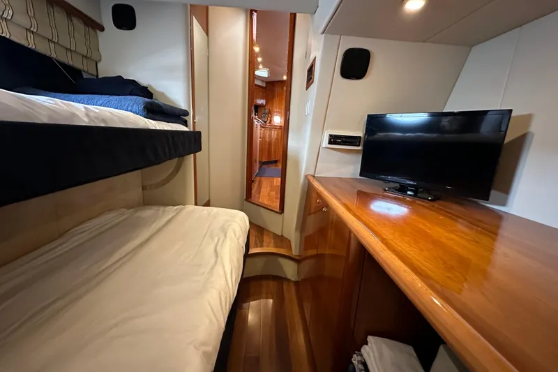 Slide: The Image of Interior of 2000 Sunseeker Predator 60 yacht with bunk beds and TV. - 60
