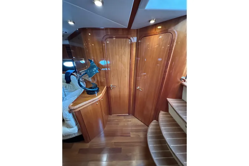 Slide: The Image of Luxurious interior of 2000 Sunseeker Predator 60 yacht with polished wood finishes. - 64