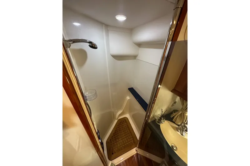 Slide: The Image of Shower area in 2000 Sunseeker Predator 60 yacht, featuring modern fixtures and wooden accents. - 68