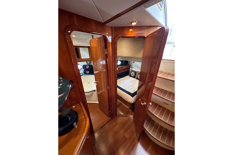 Slide: The Image of Luxurious interior of 2000 Sunseeker Predator 60 yacht with polished wood and cozy cabin. - 72
